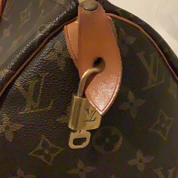 Louis Vuitton Brown Duffel Bag with Iconic Monogram and Leather Trim - Picture 12 of 16